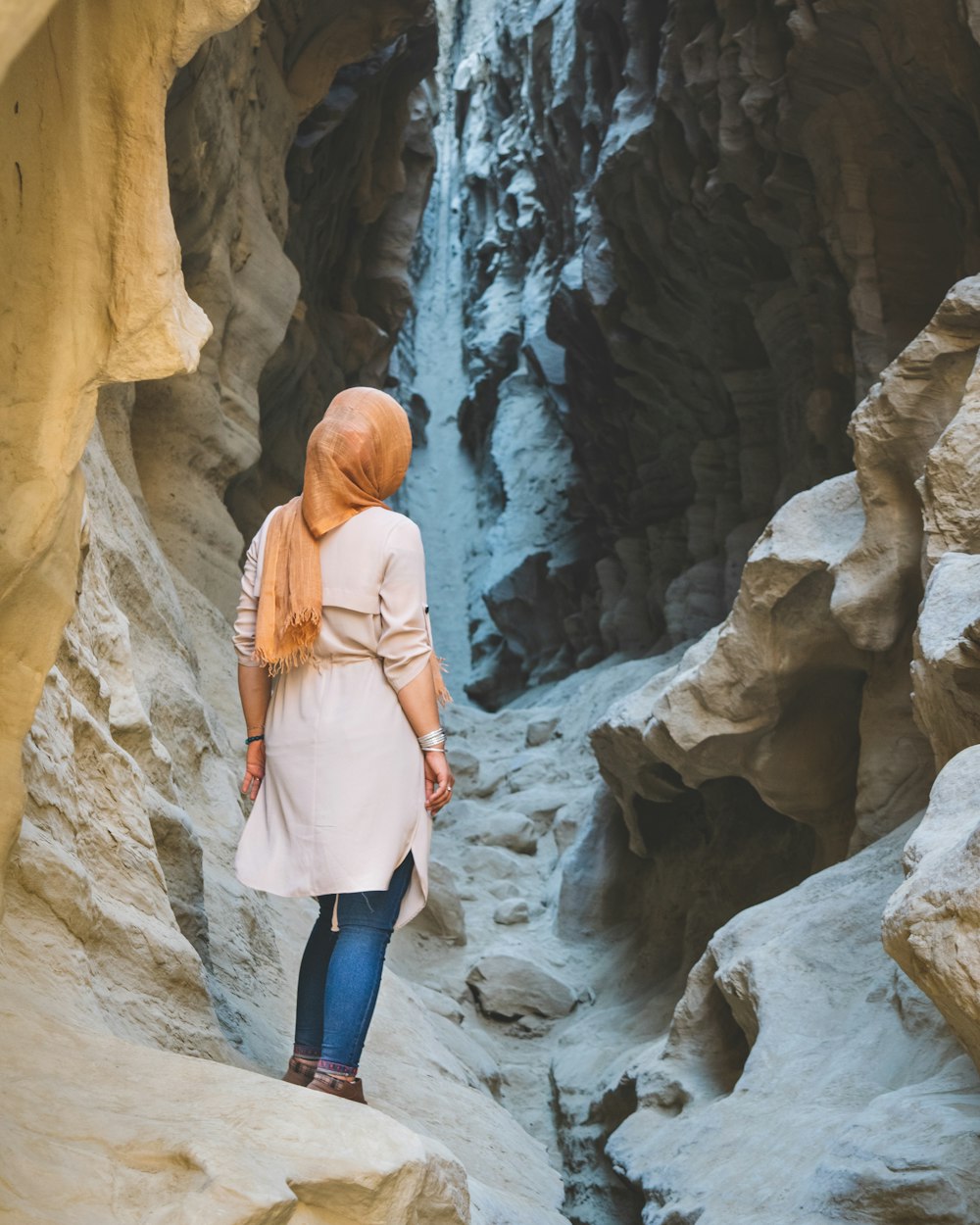 woman standing on rock