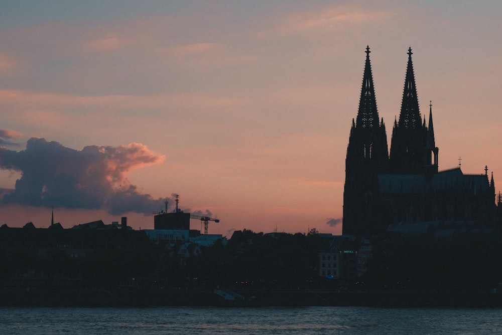 silhouette photography of church under cloudy sky during daytime