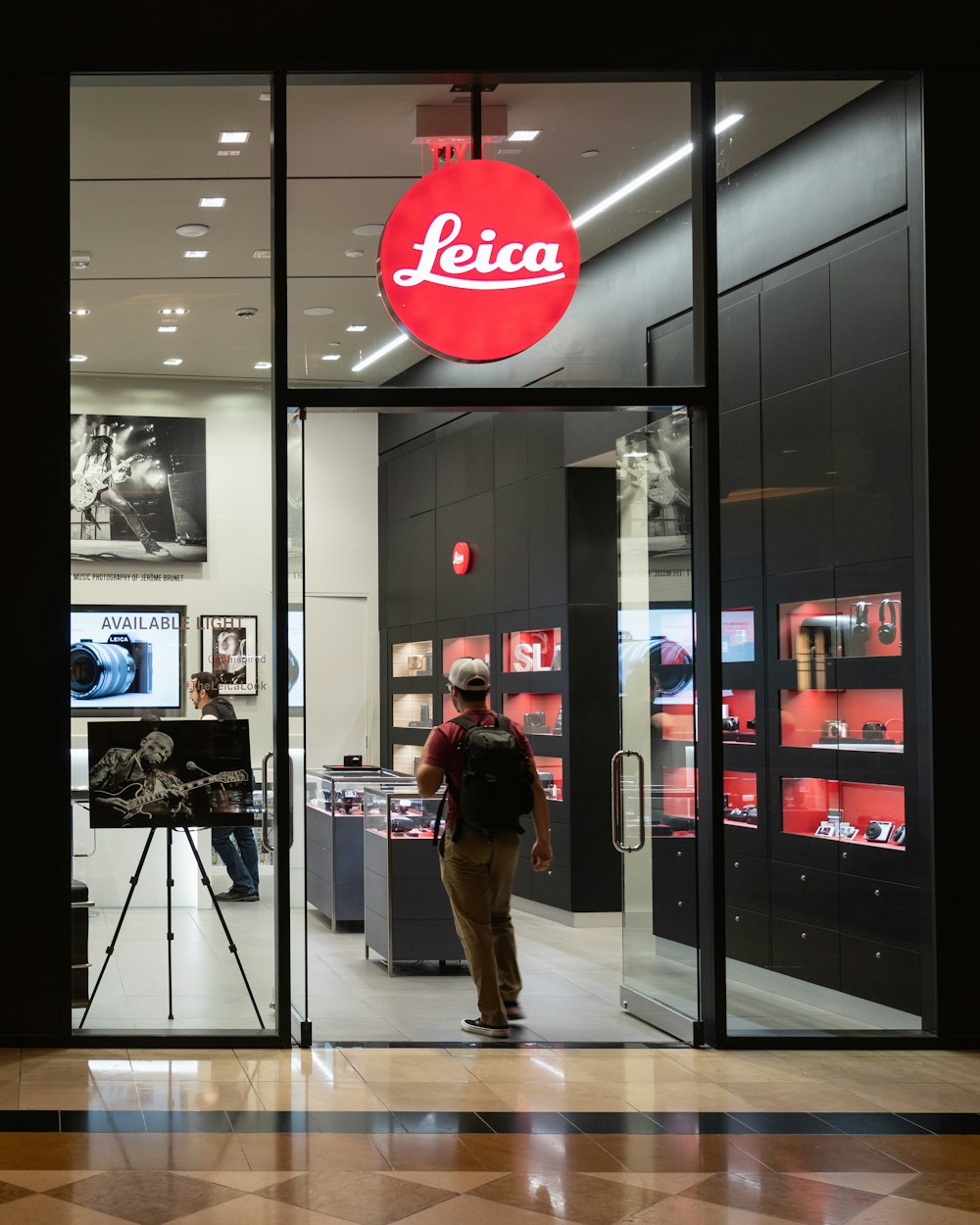 person standing inside Leica store