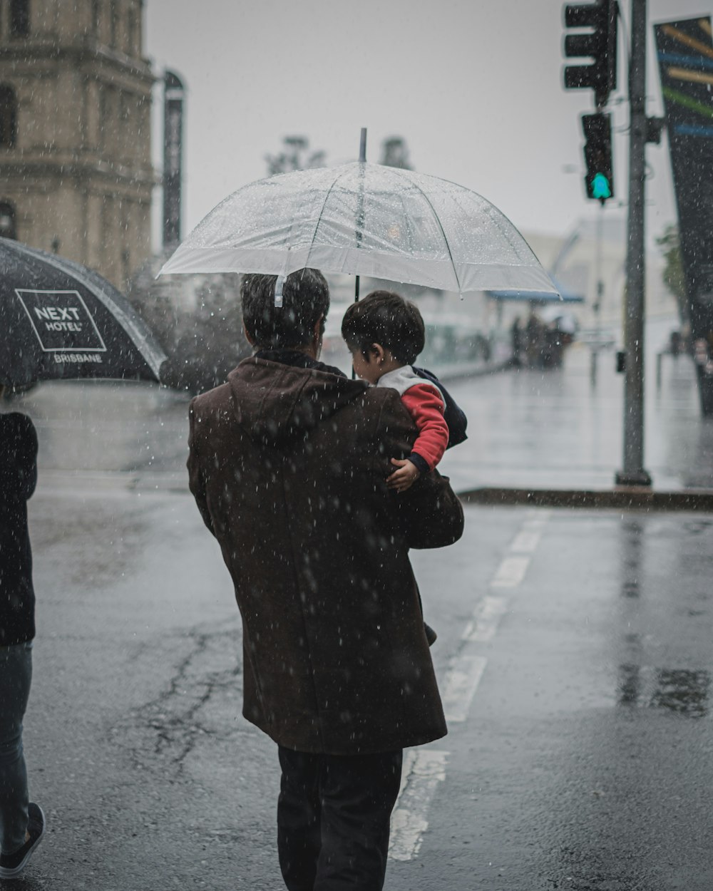 man carrying baby