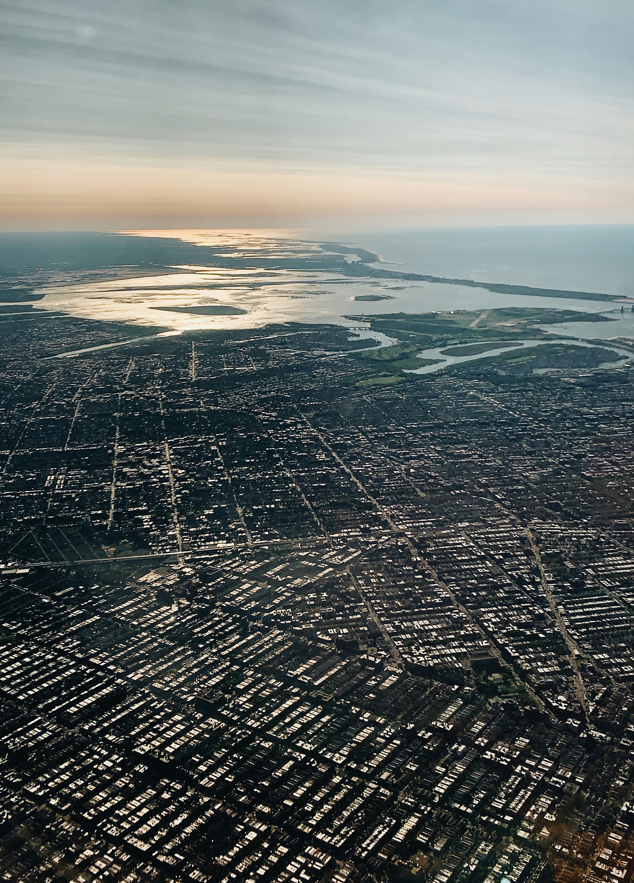 an aerial view of a city and a body of water