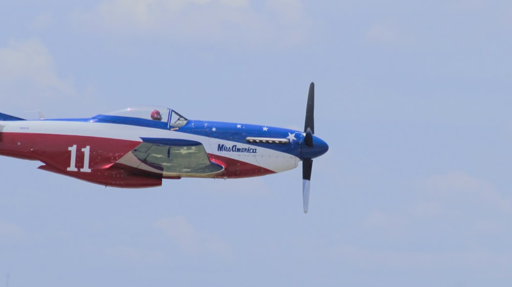 white, red, and blue airplane