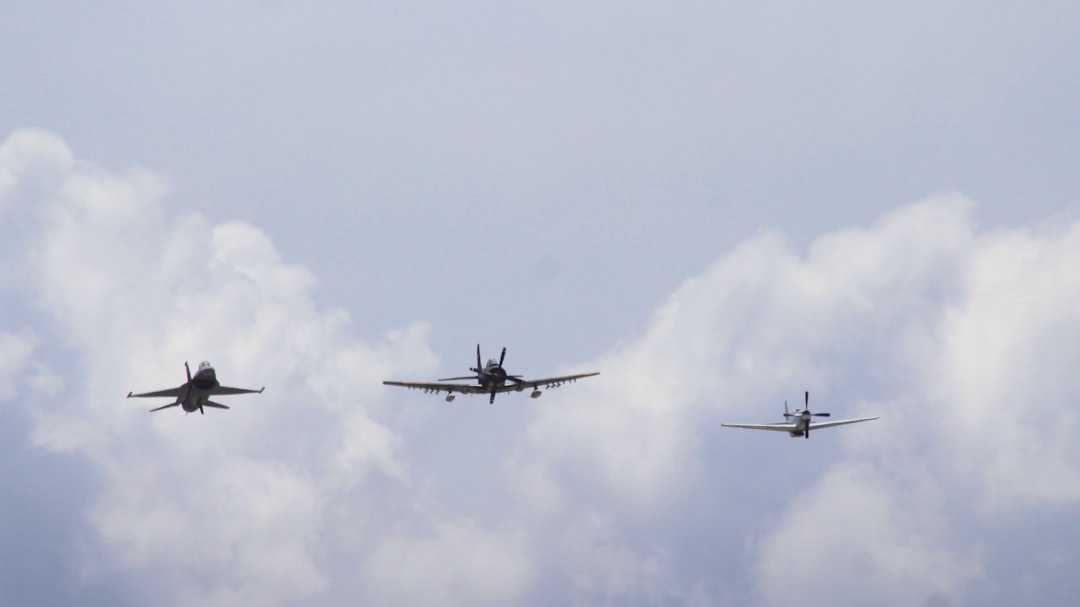 three airplanes flying on sky