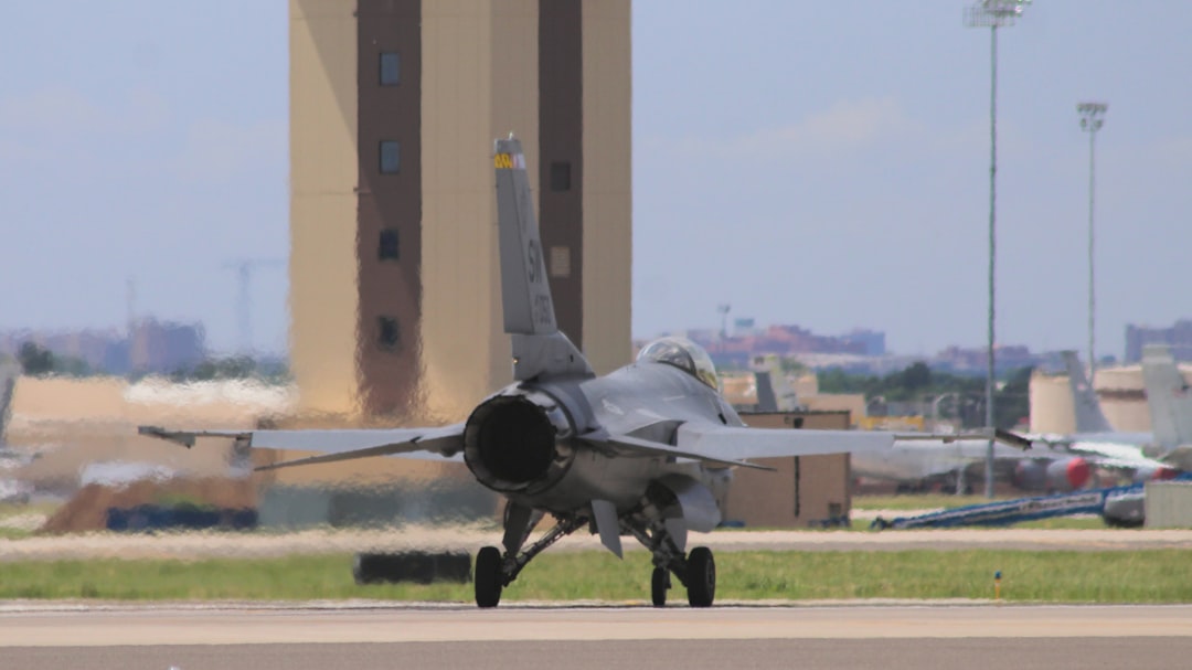 gray fighting plane on landing area