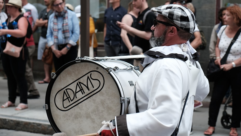 man holding drum during daytime