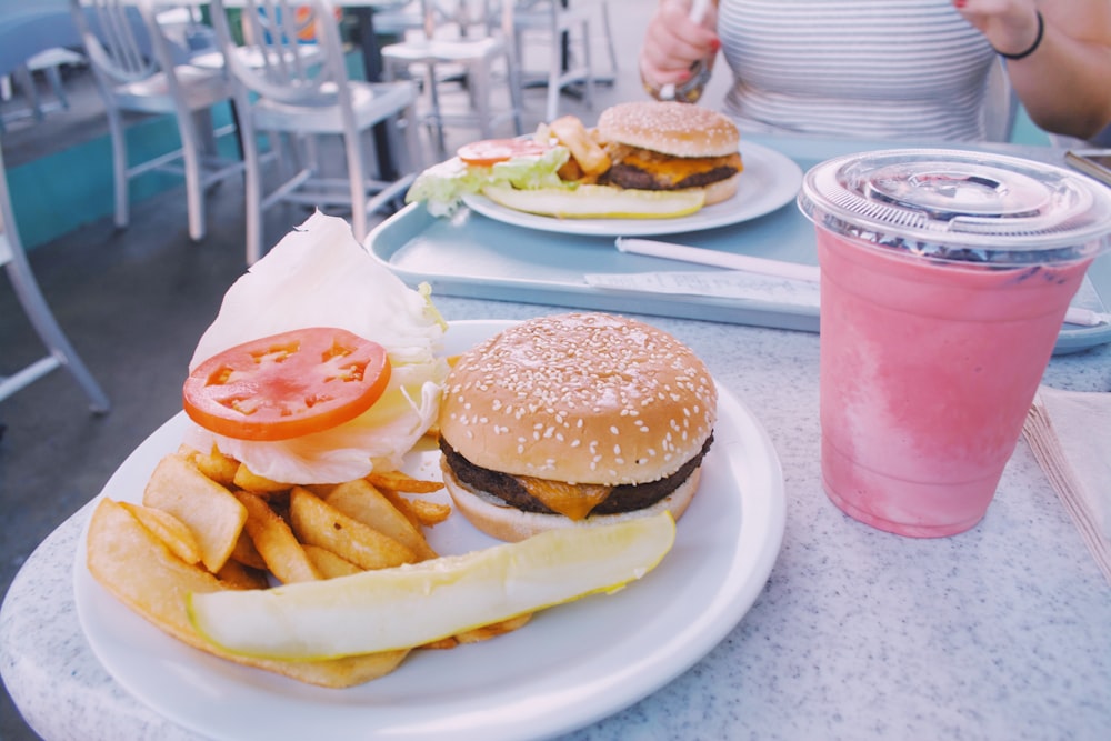 hamburger and potato fries meal on table