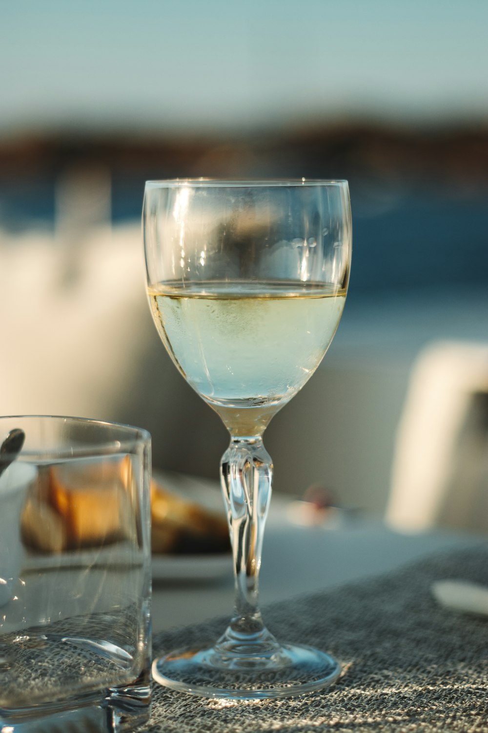 half-filled clear wine glass