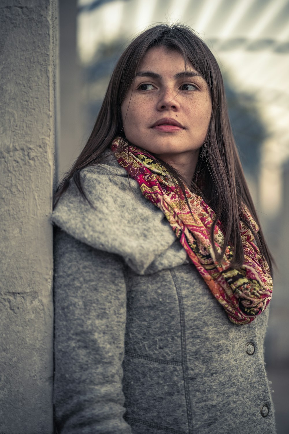 woman leaning on wall