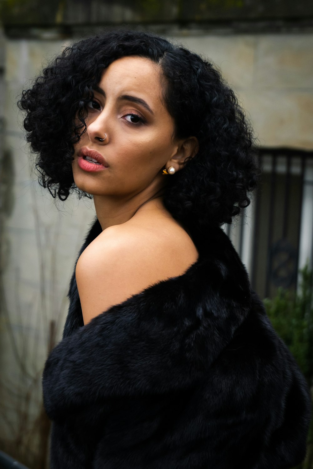 shallow focus photo of woman in black fur jacket