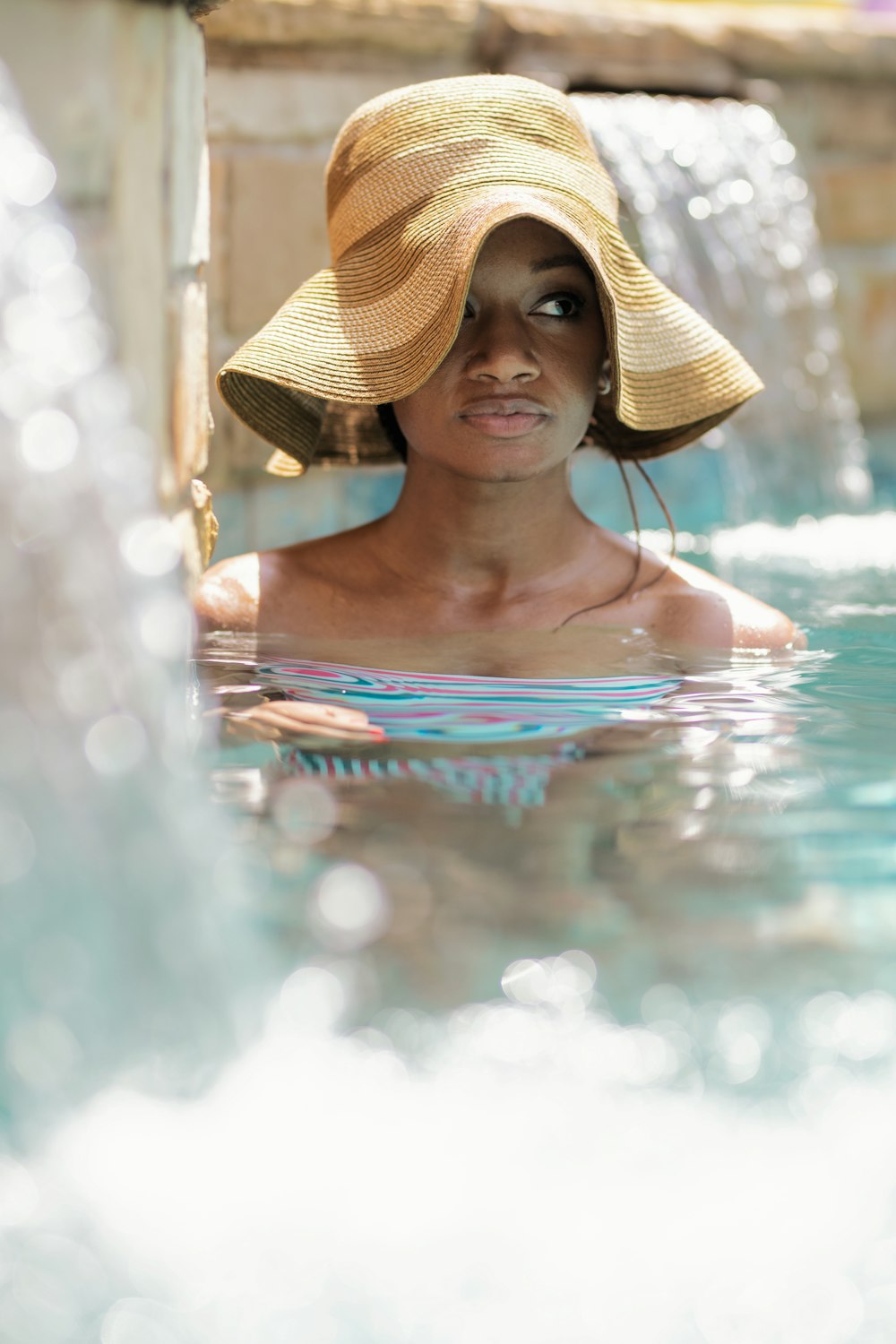 woman wearing brown hat on water