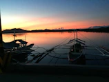 Sunset view over the turquoise waters of Zanzibar with traditional dhow boats.