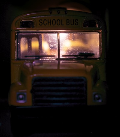 A candid photo of Bruce Phelps standing beside his school bus on a quiet Kansas morning.
