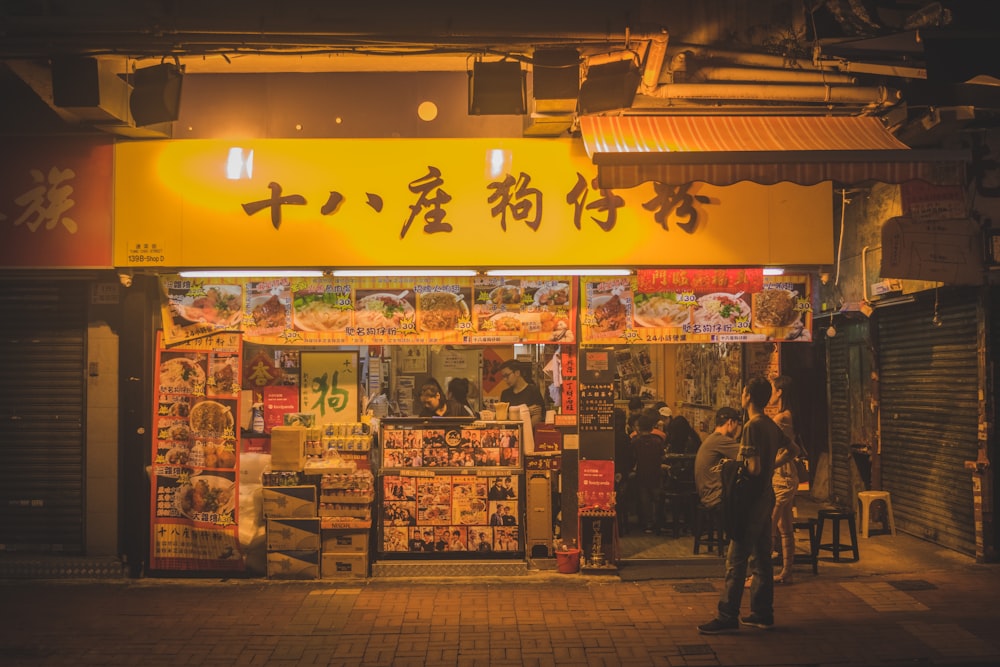 person standing near store