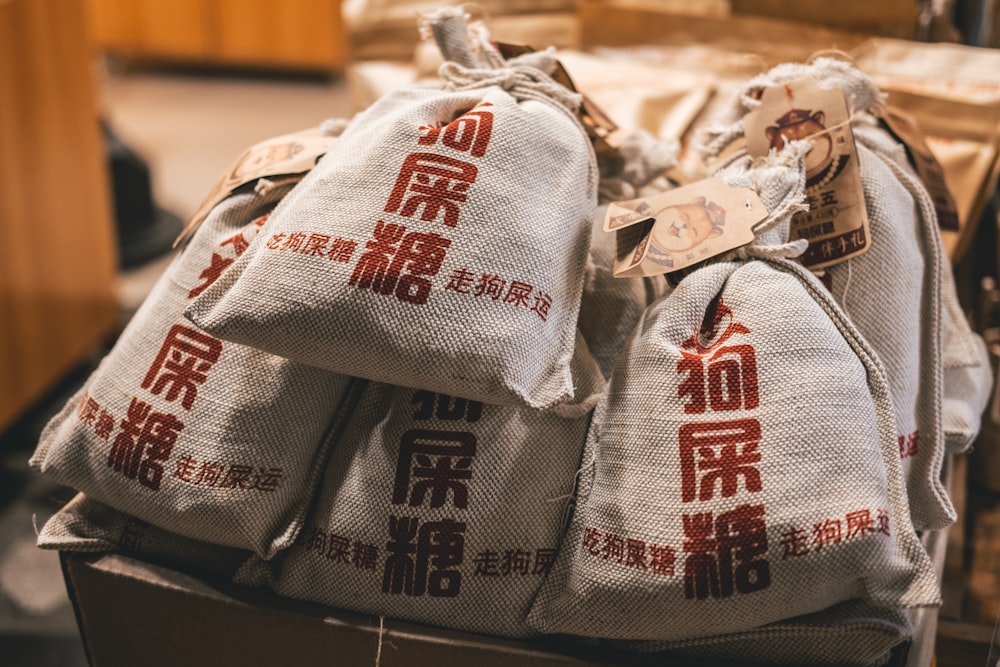 bags of rice sitting on top of a wooden table