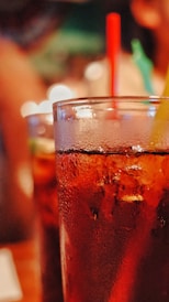 juice in drinking glass with straw