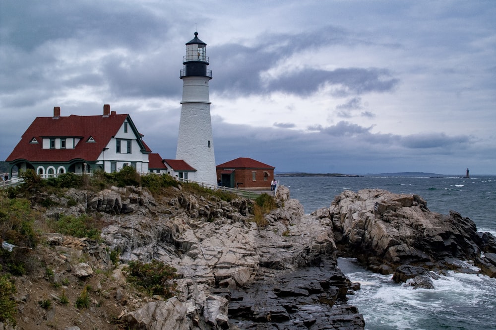 white lighthouse near shore