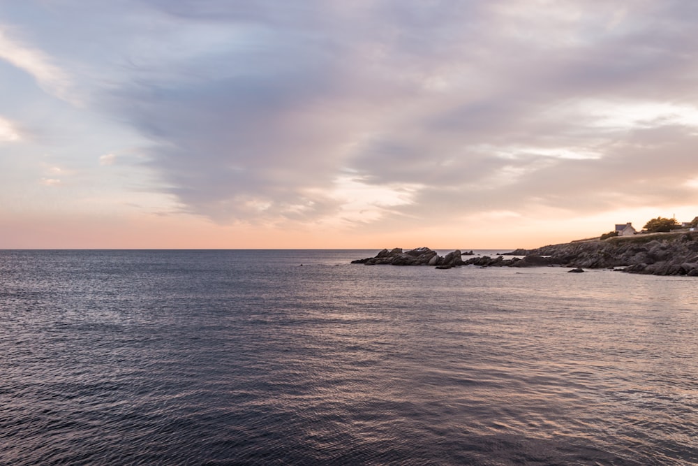 calm sea under gray sky