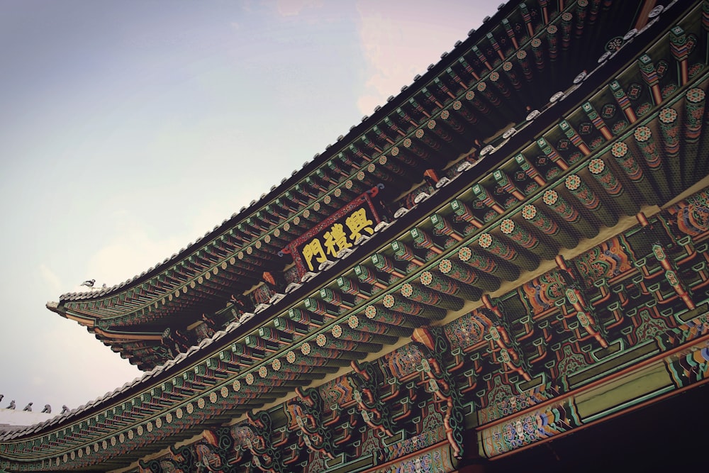 red, green, and black temple close-up photography