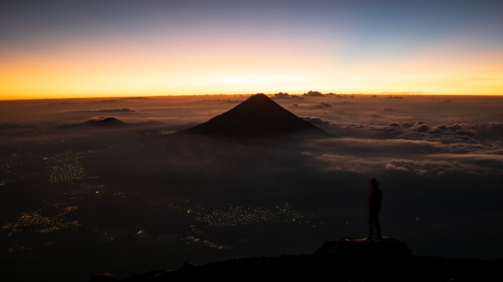 man standing on mountain