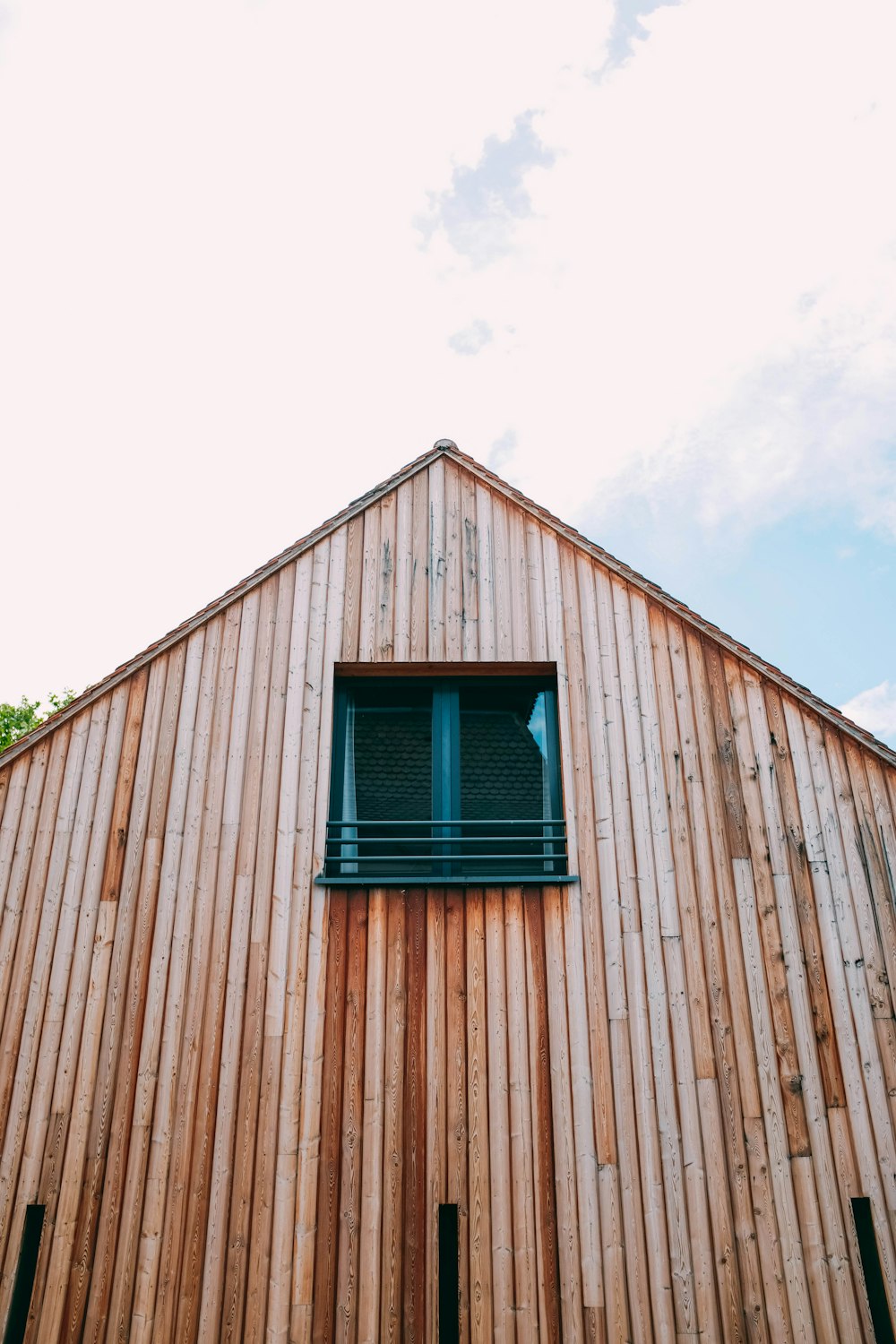 brown wooden house under white sky at daytime