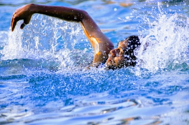 man swimming-subtitle-Add Cardiovascular Workout-topic-How to Get Lean Mass Body