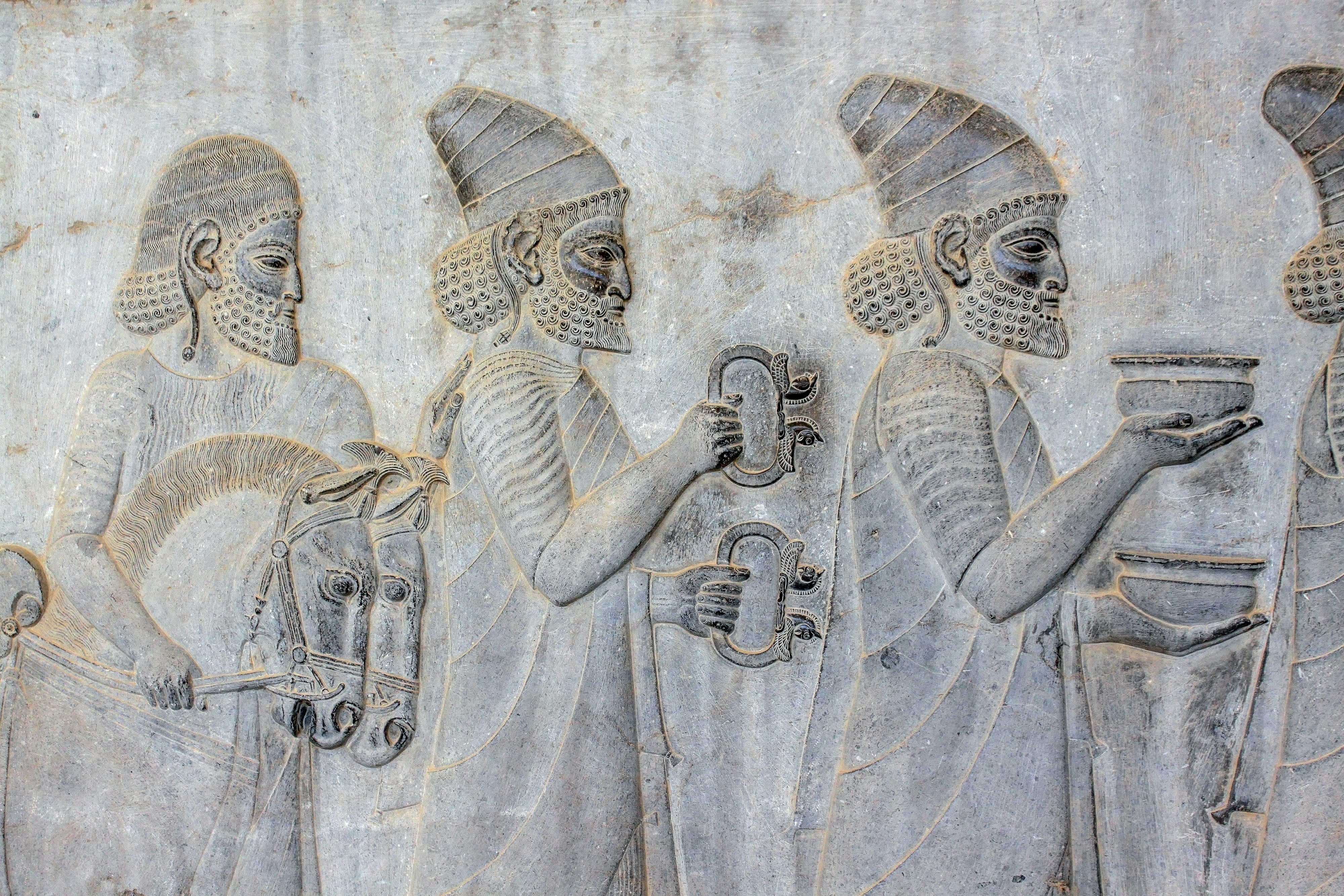 ancient embossed artwork of men