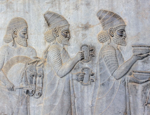 ancient embossed artwork of men