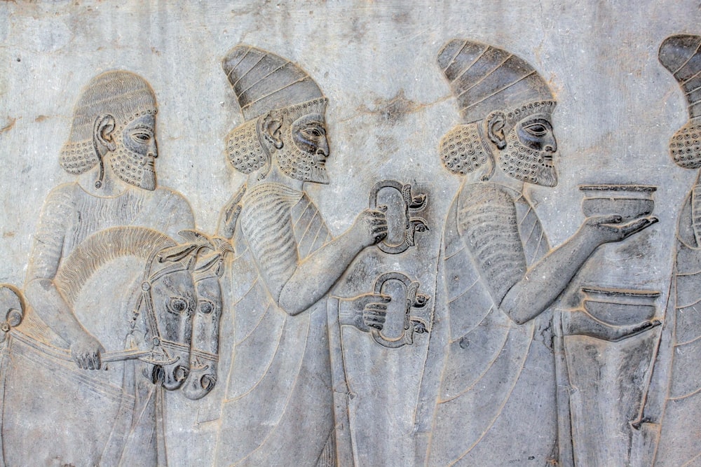 ancient embossed artwork of men