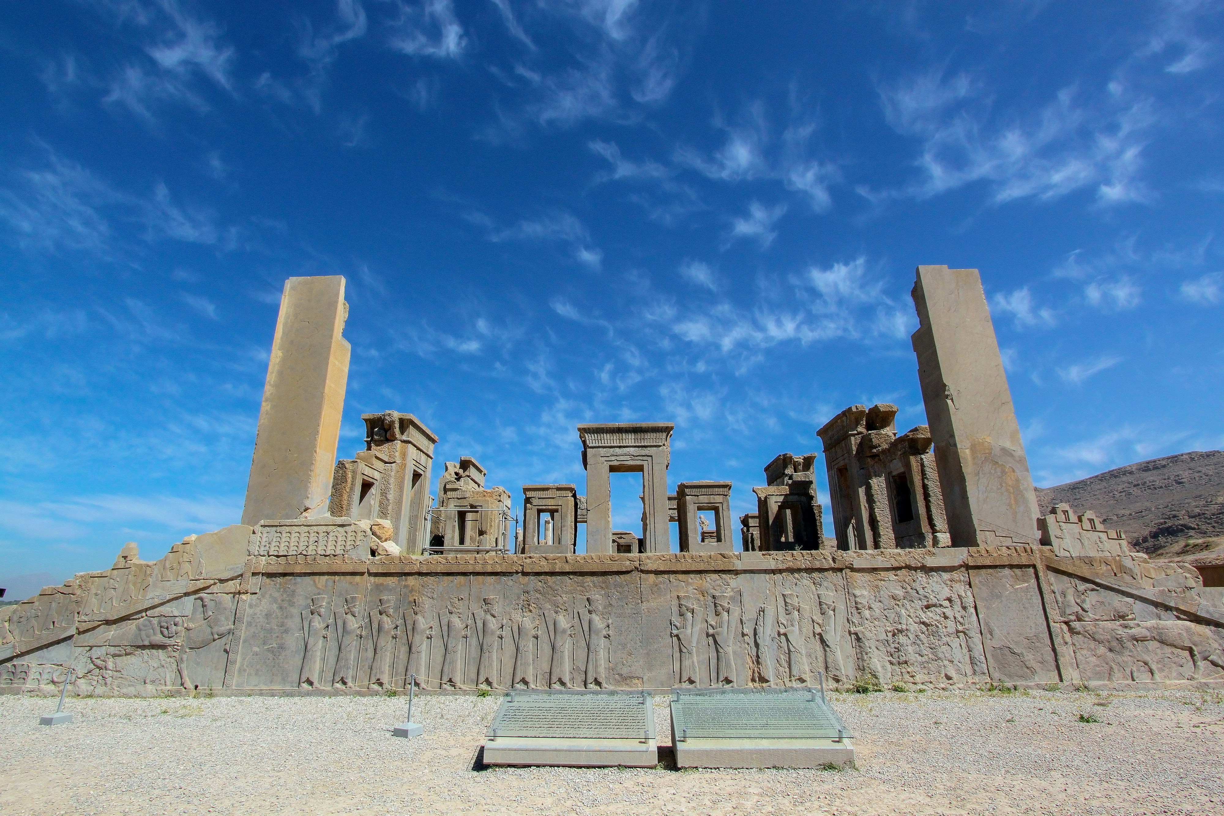 Persepolis. was the ceremonial capital of the Achaemenid Empire. It is situated 60 km northeast of the city of Shiraz in Fars Province, Iran. The earliest remains of Persepolis date back to 515 BCE. It exemplifies the Achaemenid style of architecture. UNESCO declared the ruins of Persepolis a World Heritage Site in 1979.