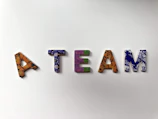 assorted-color A Team text wall decor