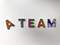 Lettre  faisant le mot A TEAM pour montrer l'esprit d'équipe
