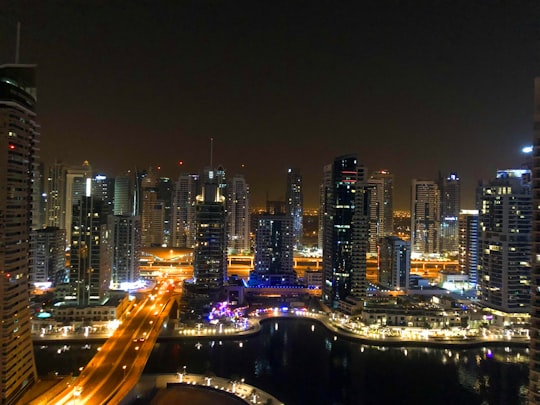 timelapse photography of road and building during nighttime in Jumeira United Arab Emirates