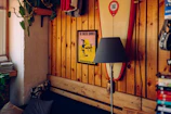 Interior of a bungalow showing a comfy bed and surfboard decoration