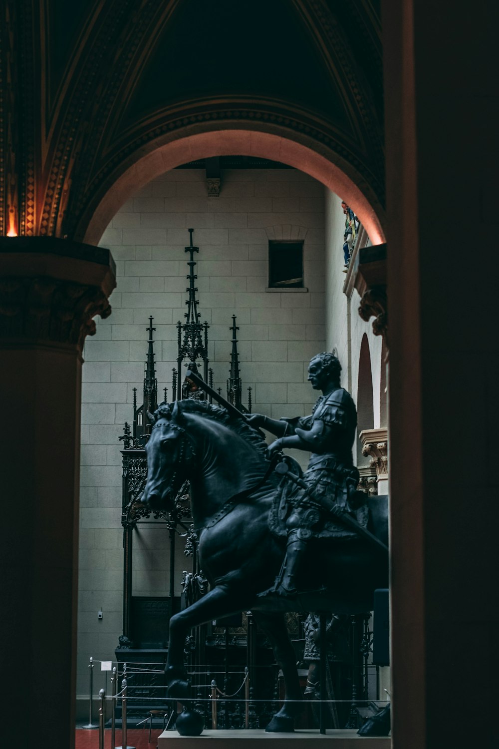 knight riding horse statue inside building