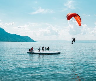 person doing paragliding during daytime