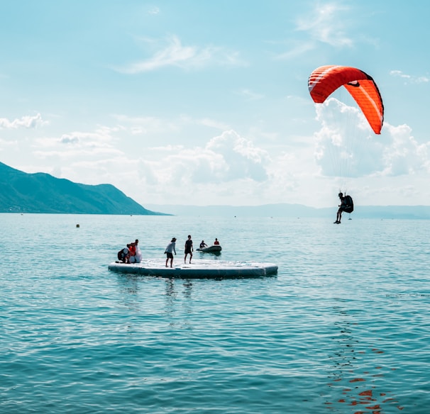 person doing paragliding during daytime