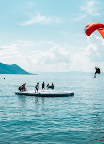 person doing paragliding during daytime