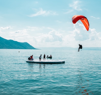 person doing paragliding during daytime