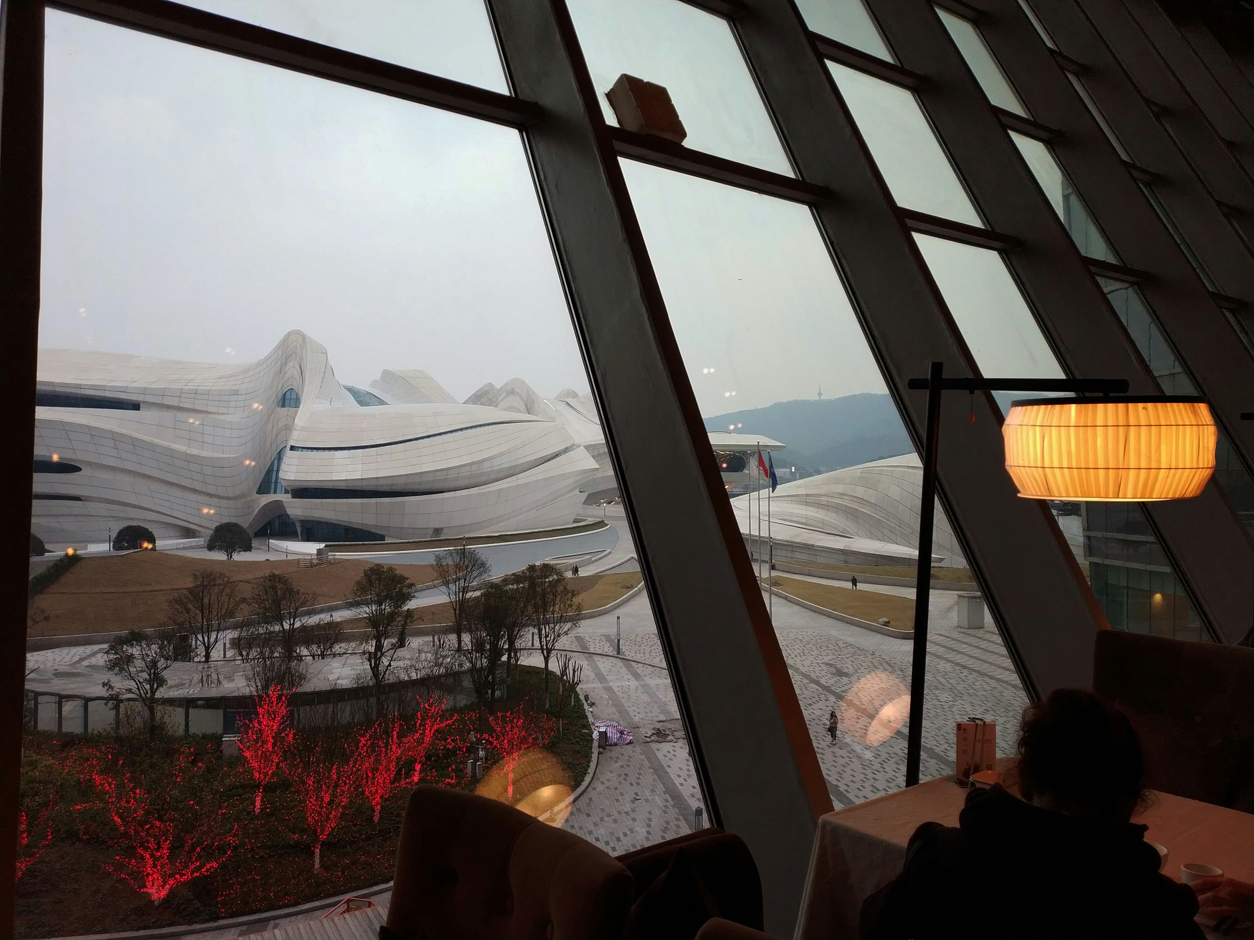 Changsha Meixihu International Culture and Art Center, a Zaha Hadid Architects building, from a lakeside restaurant.