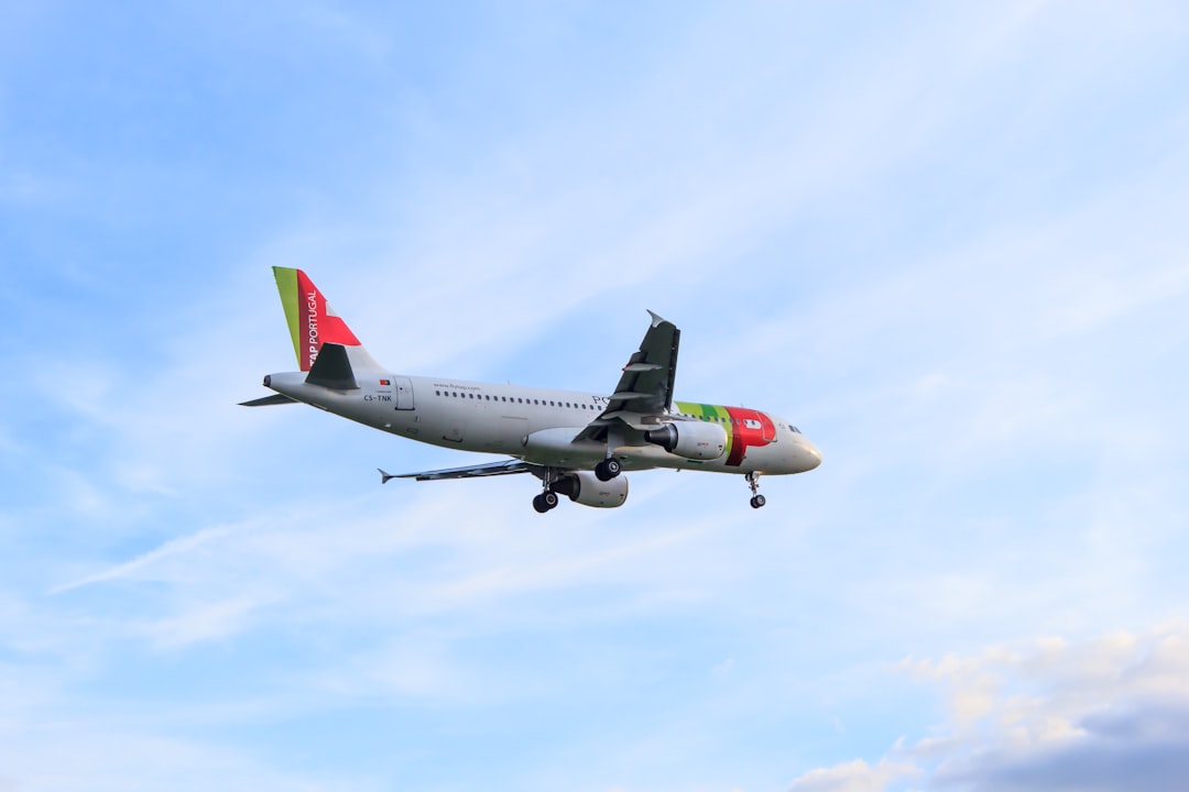 white and red airliner,