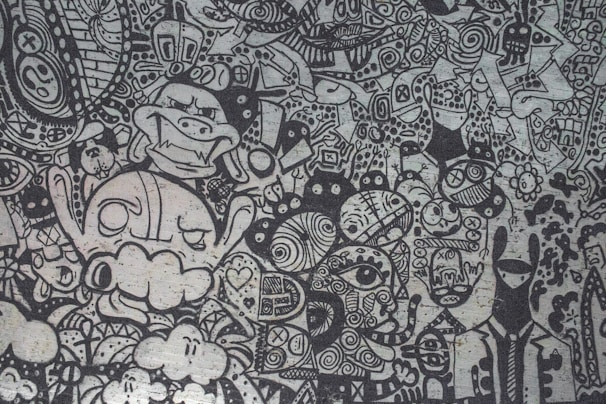 An artistic blend of dark shadows and bright, twisted cartoon faces merging together.