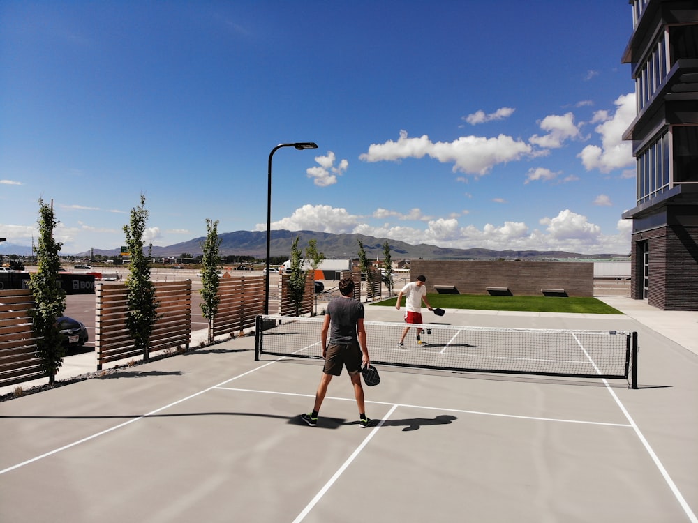 two men playing tennis