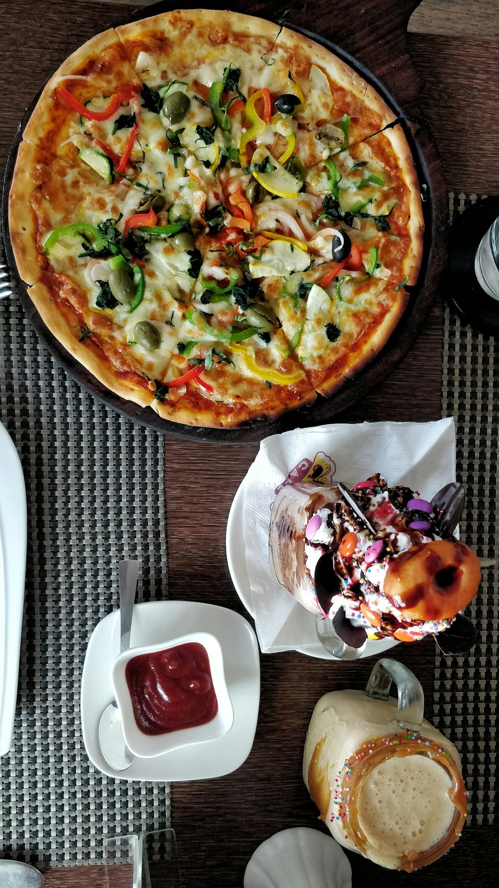 pizza and dessert on table