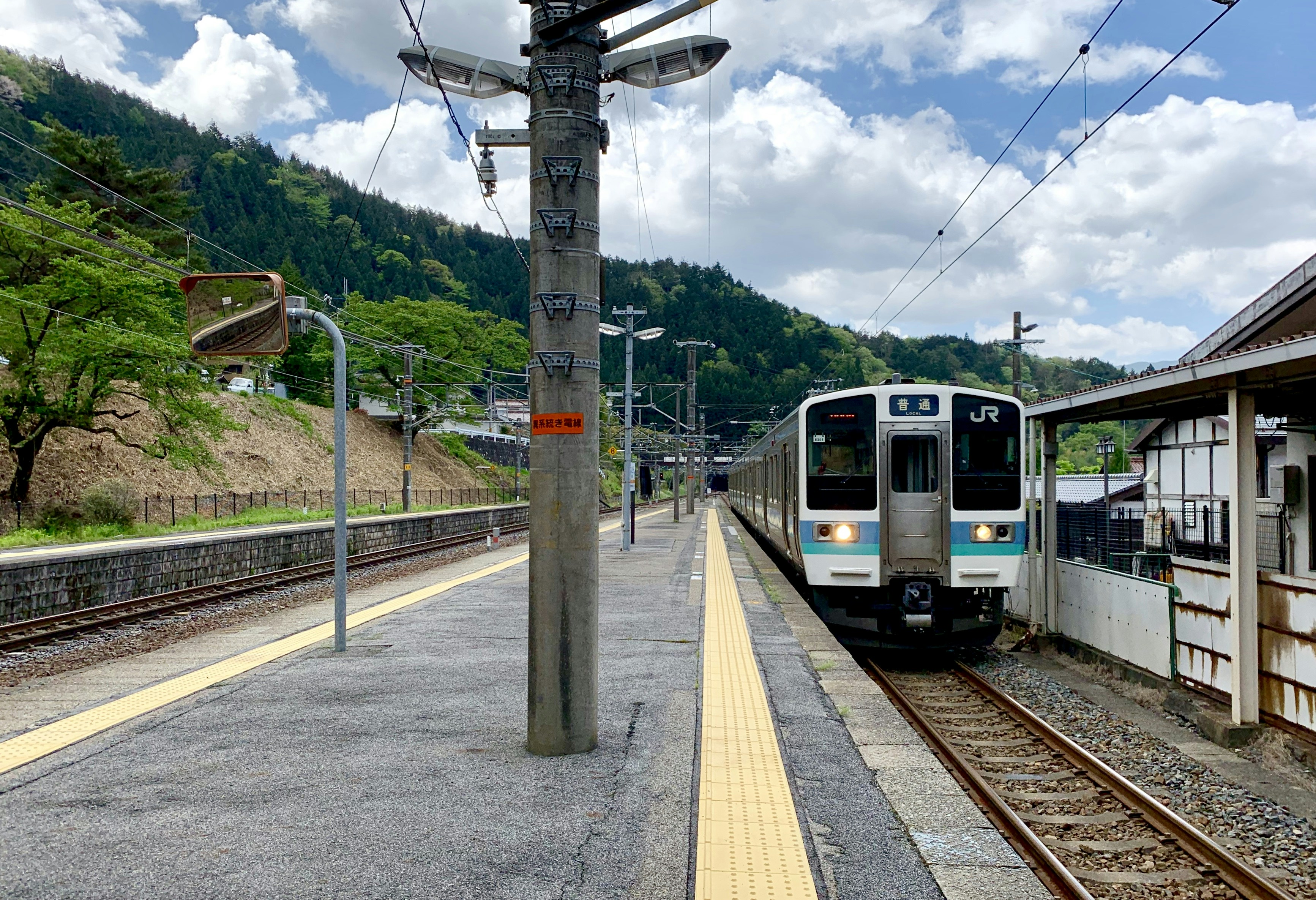 black and white train on railway at daytime