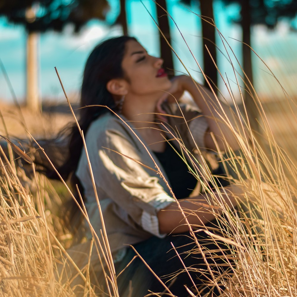 woman sitting near plants