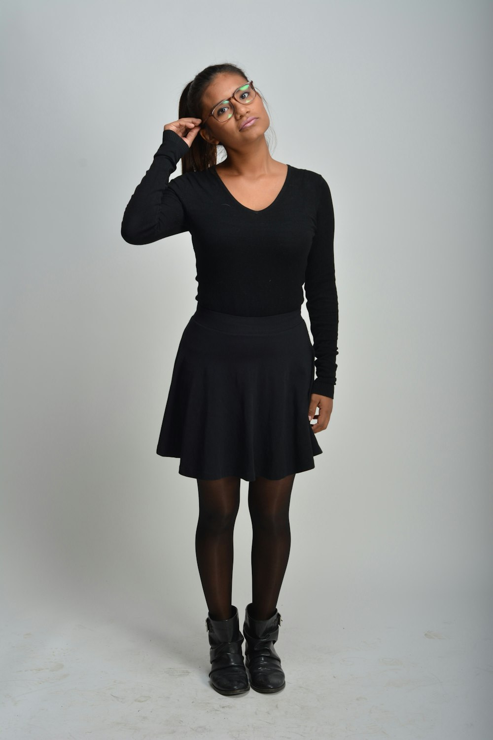 woman wearing black long-sleeved dress