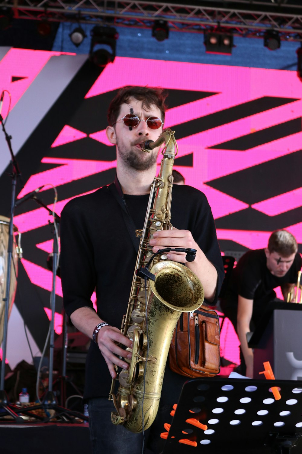 man playing brass saxophone