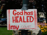God has healed my doubt placard posted on pole