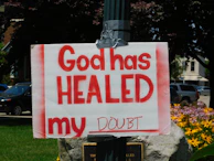 God has healed my doubt placard posted on pole