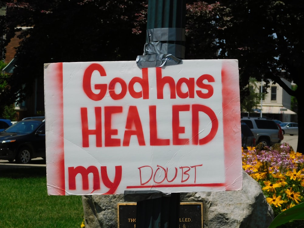 God has healed my doubt placard posted on pole